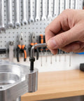 Hand using Allen wrench on 1600 Piece Carbon Steel Socket Head Cap Screw Set Black Oxide Metric Hex Allen Bolts With Flat Washers