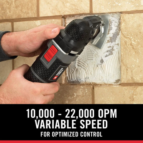 Person using 3 Amp Oscillating Multi Tool Kit With 52 Pieces, Variable Speed 10,000 To 22,000 OPM for tile removal on wall