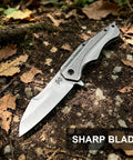 EDC Pocket Knife With 3.5 Inch Flipper And Liner Lock 420C Stainless Steel Blade on forest ground