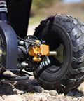 Close-up of rear brake caliper go kart brake kit with beefy performance brake pads on a 50cc to 250cc ATV wheel, easy install.