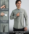 Men's Long Sleeve Sun Protection Shirt Built For Fishing Trips And Outdoor Adventures With UPF 50 Plus Quick Dry Mesh Fabric Button Down SPF Shirt For Hiking Camping Safari Gray Green featuring 6 pockets, zipper and snap button details.