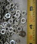 Heavy Duty Stainless Steel Clinch Nuts 8-32 Thread Pack Of 50 Corrosion Resistant threaded inserts on a flat surface.