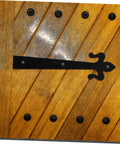 Front view of HAKIDZEL heavy-duty cabinet/garage door hinge, black iron, installed on wooden door with visible screws.