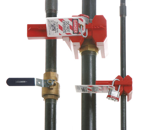 Red Ball Valve Lockout For One Half To Two And A Half Inch Pipe in use, securing valve with polypropylene body, industrial tagout gear.