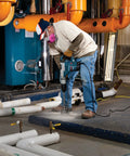 Worker drilling with Three And A Quarter Inch Two Piece Rotary Hammer Core Bit With Wave Design For Up To Forty Percent Faster Drilling