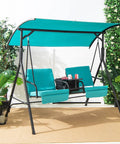 Two Person Porch Swing With Pivot Storage Table And Cooler Bag, Dual Cup Holders, Removable Cushions, Adjustable Canopy, Outdoor Patio Swing For Backyard Balcony Or Poolside, Turquoise shown on a patio.