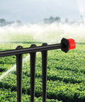 200 Pieces Drip Irrigation Support Stakes And Tubing Hose Holder For One Quarter Inch Tubing in a lush vegetable garden