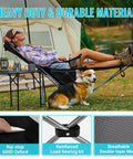 Person relaxing in a 2 In 1 Reclining Camping Chair With Footrest For Adults Folding Lounge Chair next to a tent, featuring durable 600D Oxford fabric.