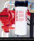 Three Quarter Inch Thread Spin On Fuel Filter With Ten Micron Rating For Up To Twenty Five GPM Fuel Transfer Systems Protect Pumps Engines And Injectors In Auto And Industrial Setups attached to a red fuel pump