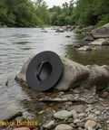 Old School Medieval Steel Buckler Shield Handcrafted With Wooden Grip, 16 Gauge, 30 Cm Round, on river rock