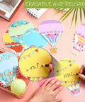 Hands writing on Colorful Fun Hot Air Balloon Cutouts Set Of 45 5 By 7 Inch Classroom Bulletin Board Accents For Back To School