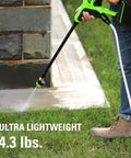 Person using Cordless 24V 600 PSI Pressure Washer Power Cleaner With 4Ah USB Battery And 2A Charger 5-In-1 Adjustable Nozzle on patio