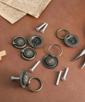 Antique Bronze Drawer Pull Rings Set Of 6 With Screws Vintage Cabinet Hardware 1.18 Inch Solid Zinc Alloy Knobs shown on leather surface.