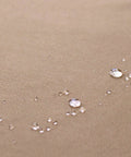 Close-up of waterproof 600D polyester fabric with water droplets for Left Facing L Shaped Outdoor Sofa Cover Waterproof For 6 Seater Sectional Couch 85 Inch Wide Left Side And 110 Inch Back Length 600D Polyester All Weather Protection For Outdoor Durability.