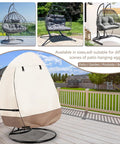 Patio Hanging Egg Chair Cover Waterproof Heavy Duty Outdoor Double Seat Swing Cover With Stand Beige And Brown Fits Up To 66W X 43D X 68H No Brainer Easy On Off Front Zippers shown on patio.