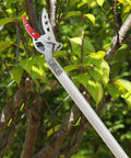 Cut And Hold Pole Pruner With 4 Point 2 Foot Reach And 180 Degree Rotating Handle, Easy Grip SK5 Steel Blade in garden