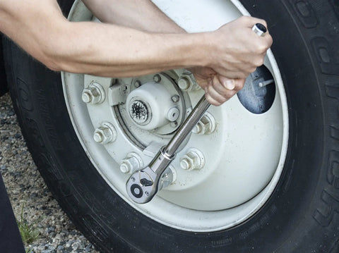 Using 3/4 Inch Drive Quick Release Teardrop Ratchet, 24-Tooth, 19-3/4 Inch Length, Chrome Finish on vehicle wheel