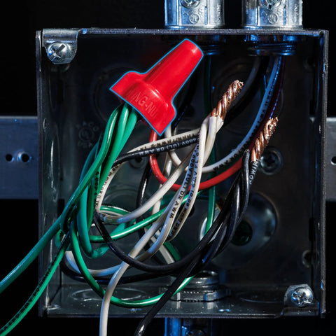 Red Wing-Nut 452 Wire Connector for DIY electrical splices in metal box, showing assembled wires and copolymer shell.