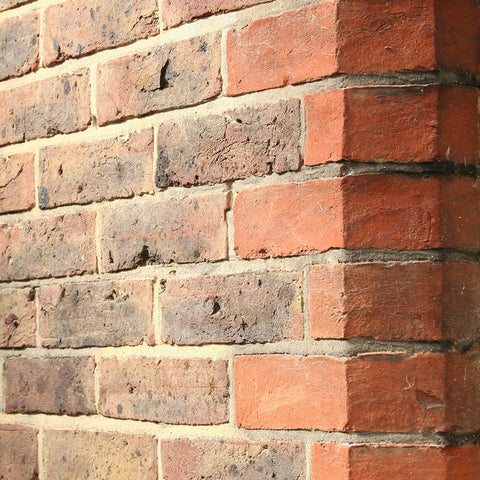 Red brick wall treated with One And A Half Gallon Clear Brick Sealer For Brick Stone Concrete And Masonry No Nonsense Cream Based Water Repellent