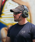 Man wearing Fugitive TAC Spartan Version 2.5 Photochromic Sunglasses For Men Built For Day And Night Use Tactical Eye Protection