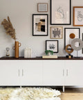 Modern living room with art wall, white cabinet with 60 Pack Square Cabinet Handles In Brushed Nickel Stainless Steel Drawer Pulls For Kitchens Cabinets Cupboards And Furniture 5 Inch Center To Center Durable Modern Hardware.