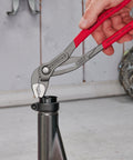 Cobra Water Pump Pliers, 10 Inch, with Adjustable Jaw and Self Locking Grip for Pipes and Nuts in use on a metal pipe