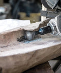 Close-up of Ball Gouge Attachment for Angle Grinder Pro Grade Power Carving Tool for Hollowing Small Concave Surfaces 30 Millimeter Diameter Self Sharpening Rotatable Replaceable Blade Arbortech BAL FG 2000 in use on wood.