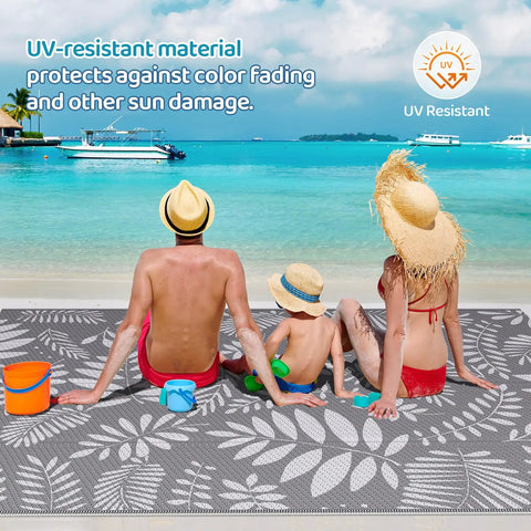 Family sitting on beach on Outdoor Rug For All Weather Use Waterproof Plastic Straw Style Mat Large 5x8 Area Rug For Outdoor Living Yard Vibes Patio Deck Backyard RV Beach Balcony Porch White And Gray