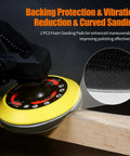 Close-up of angle grinder using 5-inch sanding pad, featuring Turn Your Grinder Into A Beast Sander With This 5 Inch 114-Piece Sanding Disc Set