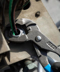 GripLock Tongue And Groove Pliers Set 6.5 Inch, 9.5 Inch, 12.5 Inch Water Pump Pliers with Permalock fastener in use on a pipe