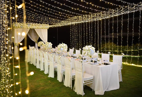 Outdoor LED Curtain Lights 30 Ft by 10 Ft With 720 LEDs, Plug In Hanging String Lights, used as twinkle backdrop for wedding decor