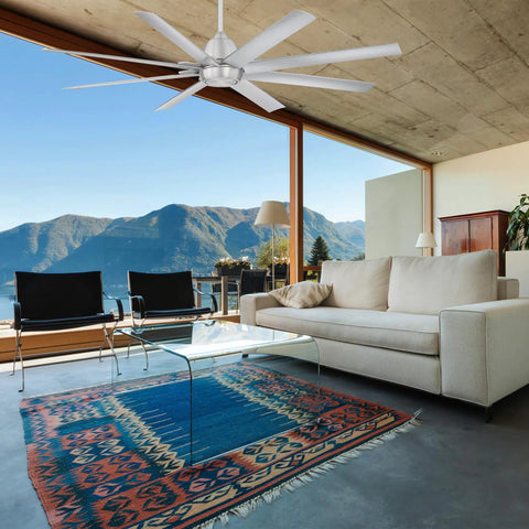 Top Notch 8 Blade Smart Ceiling Fan With Smartphone App Remote Control Compatible With Alexa And Google Assistant Energy Efficient Brushed Aluminum Finish For Large Living Spaces in modern living room setting with mountain view.