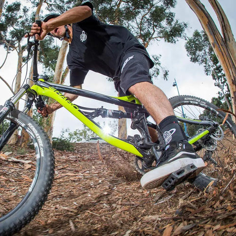Mountain biker wearing the Dope Quick Lace Ankle Brace 2.0 for all sports enthusiasts, fast slip on support for BMX MTB riding.