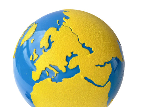 Close-up of Sandpaper Globe For Sensory Geography Learning Land And Water Tactile Globe In Solid Beechwood showing textured continents.