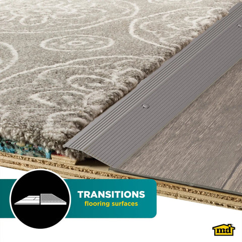 Pewter Aluminum Carpet Trim 2 In By 36 In With Screw Nails, showing transition from carpet to flooring using durable aluminum strip.