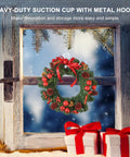Wreath hanging on window with suction cup hook, snowy winter scene, featuring 10 Pack Suction Cup Hooks Set In Three Sizes.