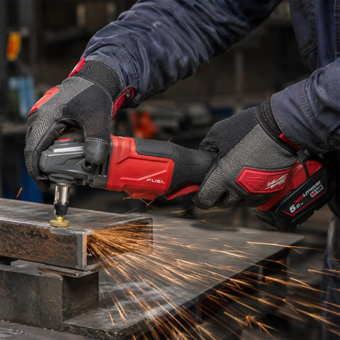 Worker using 5/8-11 Angle Grinder Extension Shaft Adapter Set With ER16 Collets on metal, generating sparks
