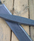 Ultra Coarse Manticore Scythe Sharpening Stone For Axes Machetes And Tools, Fast Pro Grade 260 Micron Grit on wood surface