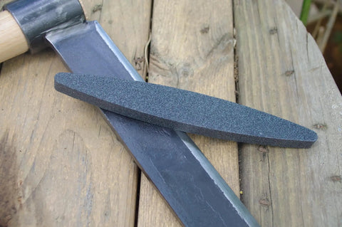 Ultra Coarse Manticore Scythe Sharpening Stone For Axes Machetes And Tools, Fast Pro Grade 260 Micron Grit on wood surface