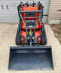 Front view of Compact 460 Mini Skid Steer Loader with Front Loader and Hydraulic Grapple Bucket Attachments for versatility