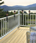 Heavy Duty Deck Torch Clamp Set Black Metal Rail Mounts For Outdoor Torches Universal Porch Rail Clamp Accessory Weatherproof Galvanized Steel Anti Rust Two Pack Fits Railings And Poles For Easy Deck Lighting installed on white railing with a scenic background.