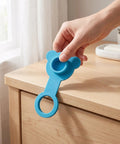Blue Silicone Bathtub Plug Stopper for 1 Inch Drains being held above a wooden surface for easier accessibility.
