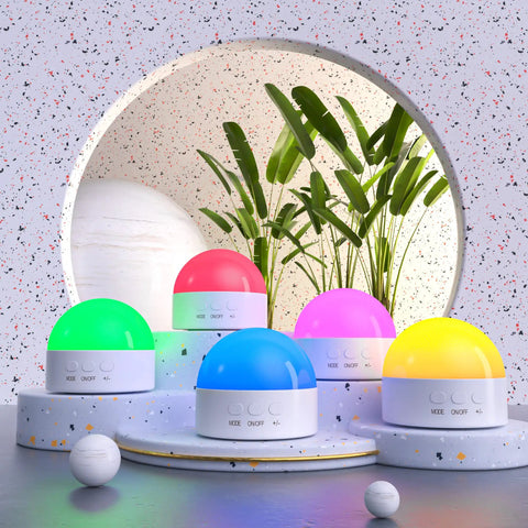 Five Portable Night Light With Dimmable RGB 8 Color LED, 1800mAh Rechargeable Battery lamps on stylish stand with plant decor.