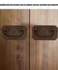 Antique Bat Style Brass Drawer Pull Handle With Two Screws for cabinets showing retro bat hardware on wooden doors