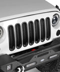 Matte Black Front Mesh Grille Inserts For 2007 2015 Jeep JK Wrangler And Unlimited With Round Slot Grilles installed on vehicle front.