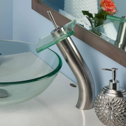 Squared Single Lever Waterfall Vessel Faucet In Brushed Nickel With Clear Glass, Solid Brass Construction next to glass sink
