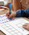 Child writing on 11 By 14 Dry Erase Multiplication Chart Whiteboard, Double Sided Multiplication Table For Homeschool And Classroom.