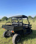 Rear view of Workhorse 1000cc All Terrain Utility Vehicle Built For Rough Sites And Industrial Jobs, off-road setting.