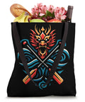 Black paddler tote bag with dragon and paddle design, filled with groceries. Paddler Tote Bag For Dragonboating Enthusiasts - Durable, Lightweight Carryall For Team Practices, Regattas, And Festivals, Perfect For Synchronous Paddling Fans And Dragon Boat Season Gear.