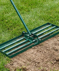 Heavy Duty Lawn Leveling Rake With 30 By 10 Inch Ground Plate And 72 Inch Adjustable Handle Leveler Tool on grass and dirt